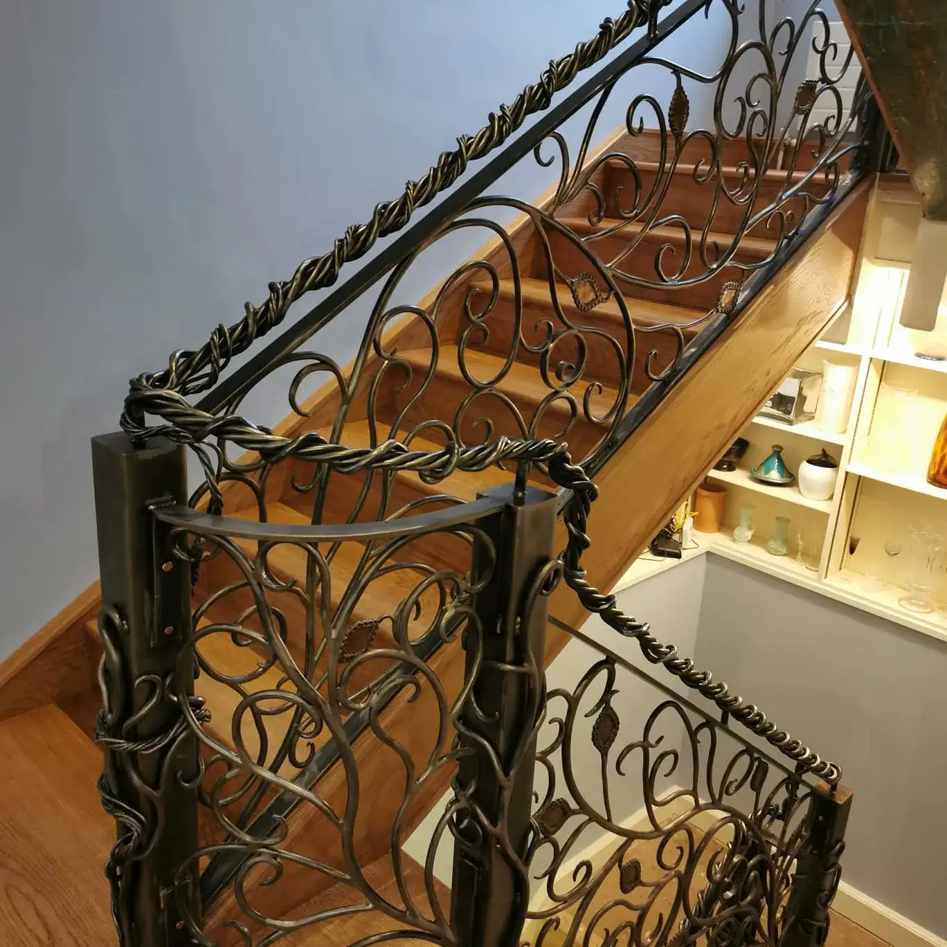 a set of stairs with wrought iron handrails